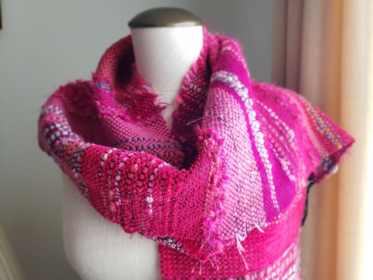 "Beautiful art scarf will make any coat or outfit sparkle. Unique! It is woven in the Saori style, which is a Japanese freestyle handwoven. This scarf was woven with a variety of gorgeous fibers: cotton, wool, novelty yarns in a delightful color combination (magenta-cyclamen-fuchsia, pink, greys, black). It will look great with a winter coat or it will add a splash of excitement to any outfit. The scarf measures  72\" long and 10\" wide which includes fringes (183x25cm) or 66\"x10\"(168x25cm) wi Pink Shawl Scarves For Fall, Pink Shawl Scarf For Fall, Pink Bohemian Scarf For Fall, Pink Bohemian Scarves For Fall, One Size Pink Shawl For Winter, Pink One Size Shawl For Winter, Pink One-size Winter Shawl, Pink Scarves As Gifts, Pink Hand Knitted Scarves One Size