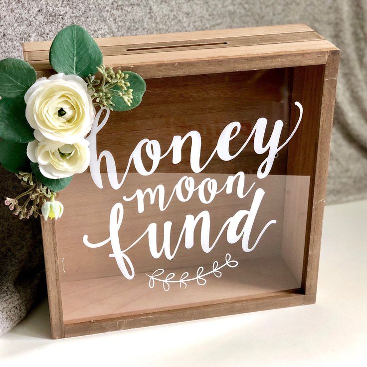 a wooden box that has some flowers in it and the words honey moon fundd here