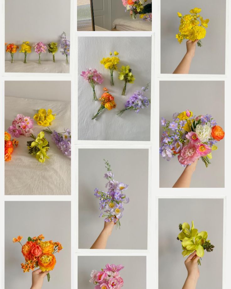 a bunch of flowers that are in some kind of hand held bouquets on a table