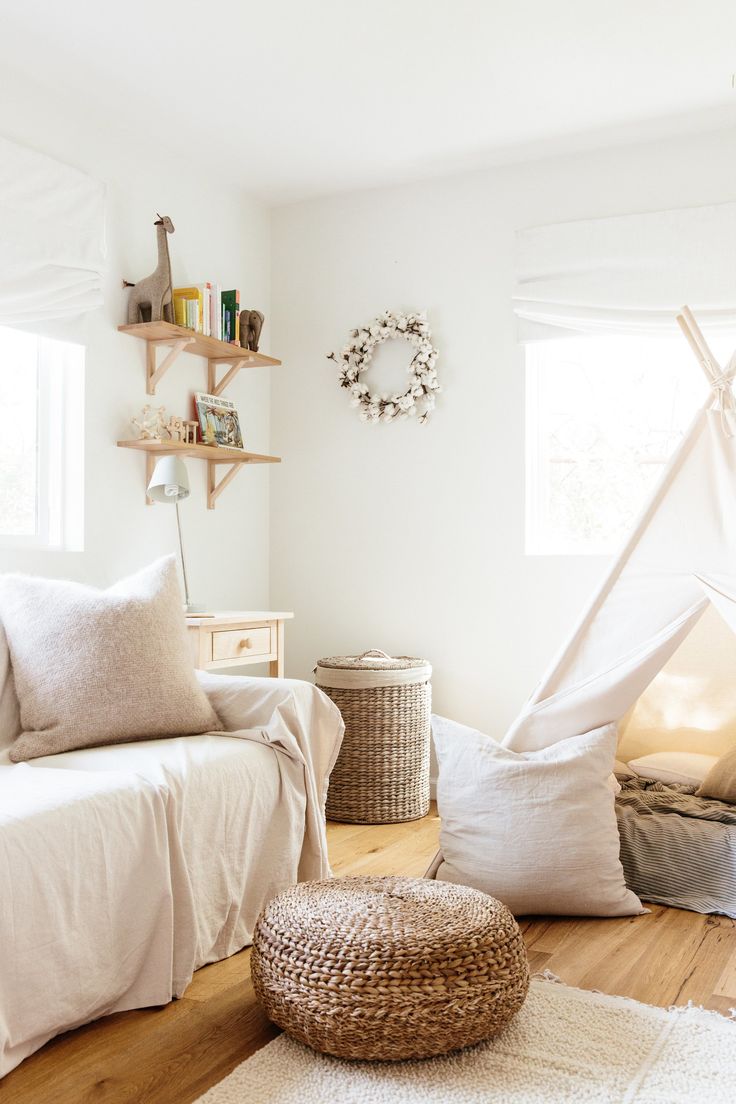 a living room filled with furniture and pillows