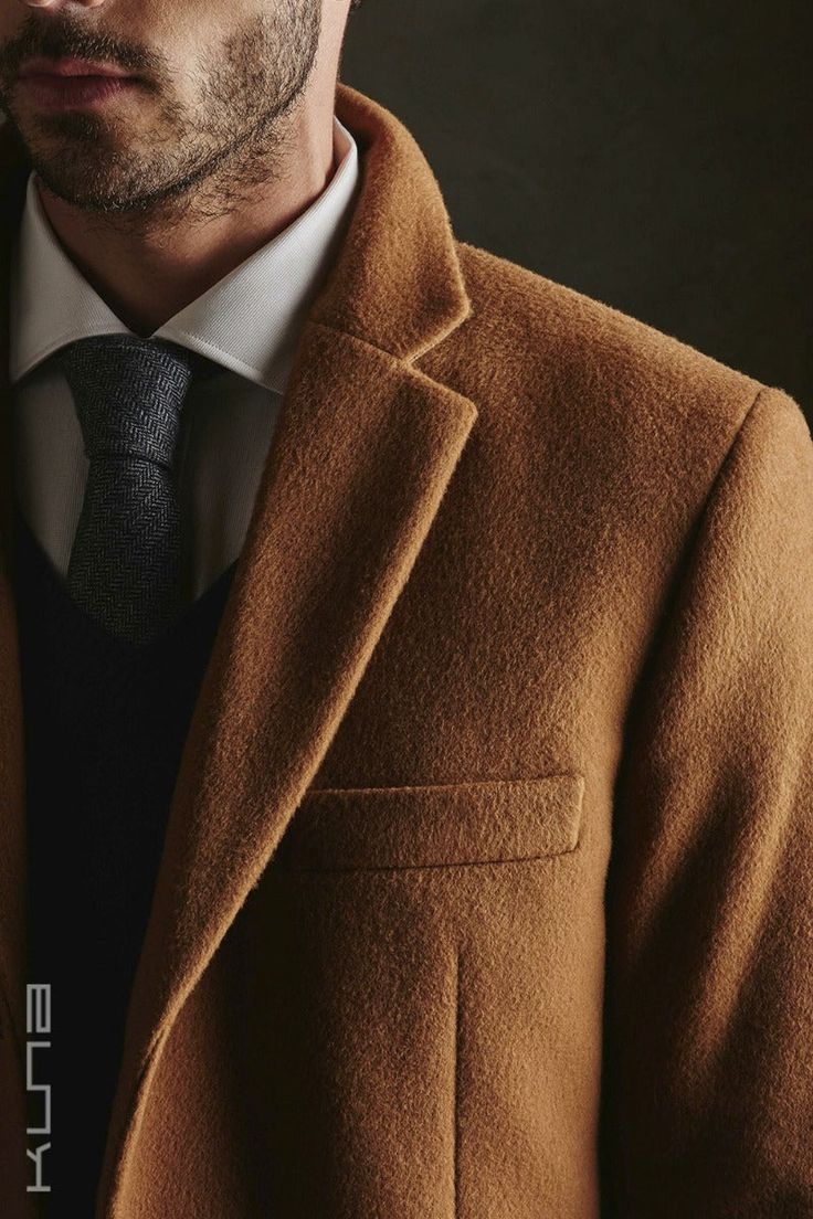 This classic men's top coat is made from 100% Vicuna fiber, the finest, softest and lightest natural fiber in the world. It is extremely soft, yet warm and the ultimate in luxury outerwear. This coat includes a hand-numbered and signed card guaranteeing the fiber came from government-controlled shearing operations. Vicunas may only be sheared every two years and produce a small amount of fiber, increasing the rarity of this beautiful product. In Inca times, only royalty could wear such amazing f Topcoat Men, Womens Sweater Coats, Luxury Outerwear, Poncho Tops, Raw Hair, Mens Luxury, Well Dressed Men, Mens Pajamas, Golden Color