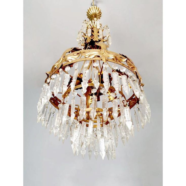 a gold chandelier hanging from the ceiling