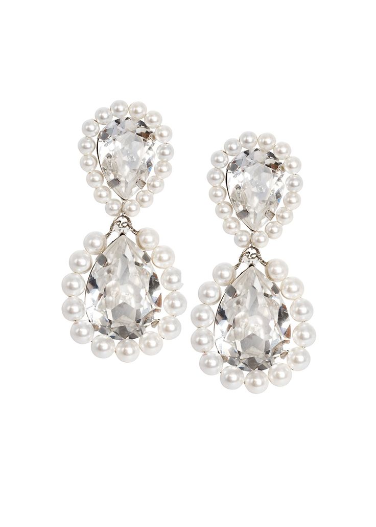 REDUCED FROM $190.00 TO $110.00 USD Add a regal touch to you look with our pearl accented Royal Drop earrings. Mini pearls surround this classic tear drop silhouette. Available in either a Rhodium/clear crystal or a gold/crystal de lite color way. Elizabeth Bower logo plate 0.78"/20mm wide x 1.57"/40mm long Post back (Clip available upon request) Shipped in gift packaging with care instructions. SALE ITEMS ARE FINAL SALE, NO RETURNS OR EXCHANGES Evening Crystal Pearl Drop Earrings, Formal Crystal Bridal Earrings With Pearl Drop, Elegant Crystal Teardrop Earrings For Formal Occasions, Teardrop Crystal Pearl Earrings For Formal Events, Teardrop Crystal Pearl Earrings For Formal Occasions, Teardrop Crystal Pearl Drop Earrings, Teardrop Pearl Bridal Earrings For Party, Glamorous Teardrop Pearl Earrings For Formal Occasions, Classic Pearl Embellished Bridal Earrings For Parties