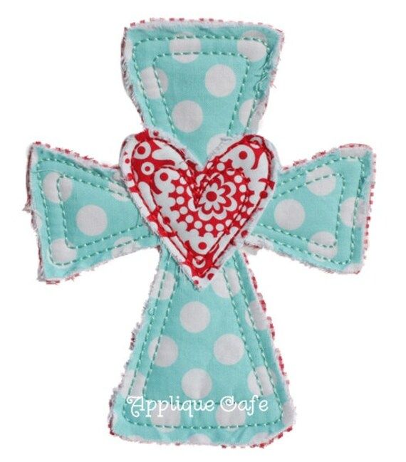 an applique cross with a heart on it