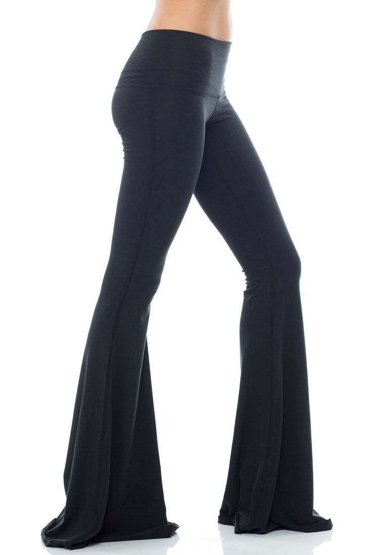 With a classic hue the Teeki Solid Black Bell Bottom will be your new go-to. This Teeki bell bottom offers an all new length 3 inches longer than the original style, allowing you to cut them to your perfect length! A chic Black hue makes the Teeki Bell Bottoms easy to wear and easy to pair with practically anything! Made of a soft recycled water bottle fabric, with breathability, and 4-way stretch, this pant ensures freedom of movement with minimal impact on the earth. With a Black Flare Loungewear Pants, Flare Yoga Pants For Fall, Black Flare Bottoms For Loungewear, Fitted Black Elastane Flares, Black Fitted Bottoms With Flared Hem, Flare Yoga Pants For Fall Loungewear, Fall Loungewear Flare Yoga Pants, Casual Black Flares For Night Out, Trendy Stretch Full Length Flares