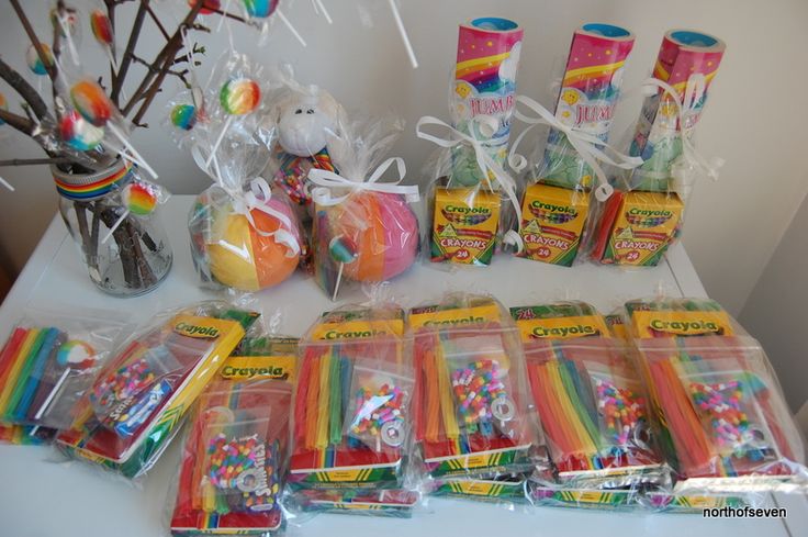 a table topped with lots of candy and lollipops