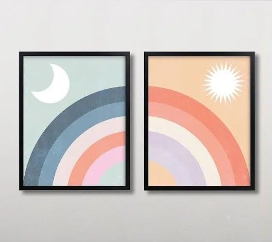 two framed art prints on a wall with the same color as the sun and moon