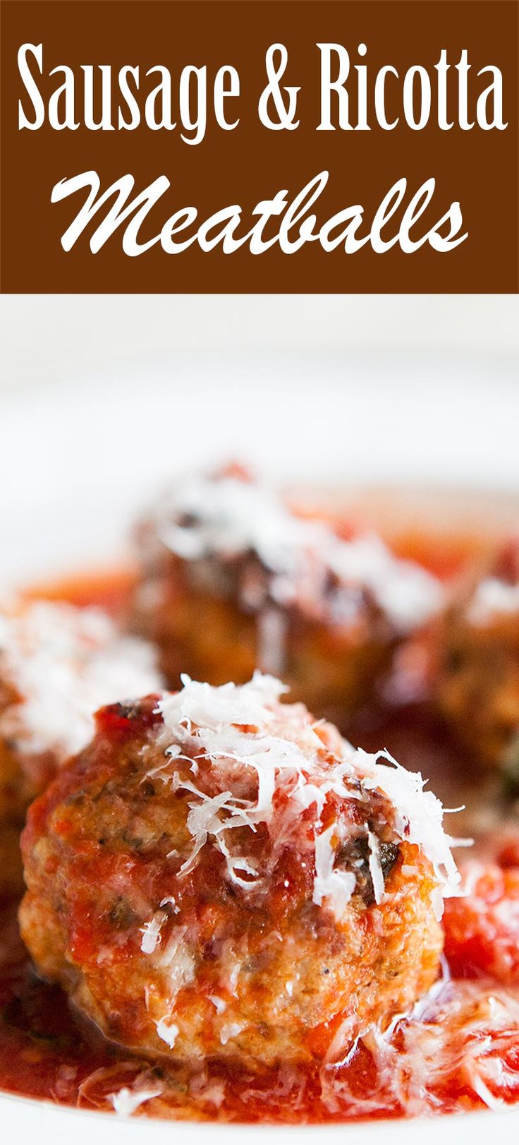 sausage and ricotta meatballs on a white plate with tomato sauce in the background