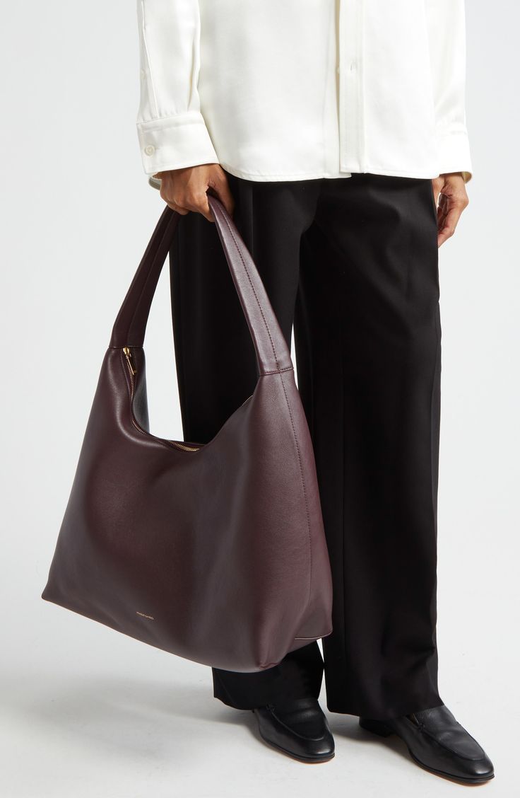 Slouchy and spacious, this oversized hobo bag is made in Italy from soft, grained leather with a supple suede lining and simple shoulder strap. Top zip closure Shoulder strap Calfskin-suede lining Leather Made in Italy Designer Handbags Nothing Written Bag, Designer Hobo Bags, Slouchy Shoulder Bag, Slouchy Leather Bag, Sew Handbag, Slouchy Bags, Hobo Bag Outfit, Baggy Bag, Designer Work Bag