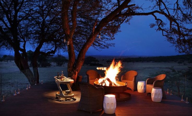 a fire pit sitting on top of a wooden deck