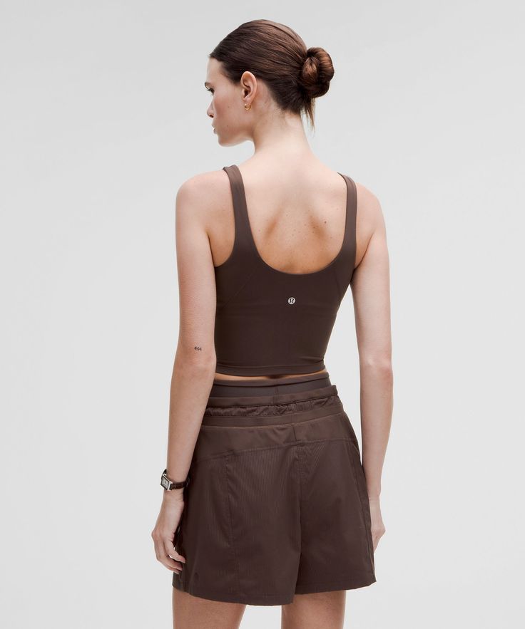 When Feeling Nothing Is Everything. The Lululemon Align Collection, Powered By Nulu Fabric, Is So Weightless And Buttery Soft, All You Feel Is Your Practice. Designed For Yoga. Sizes 0-14 Fit A/b Cups:sizes 16-20 Fit C/d Cups:tight Fit Contours Your Body:cropped Length Is Cut Above The Waist-Perfect With High-Rise Pants:intended For Low-Impact Activities. Built-In Shelf Bra For Added Support And Coverage. Pockets For Optional, Removable Cups. | Lululemon Align™ Tank Top Light Support, A/B Cup Casual Fitted Lululemon Sports Bra, Lululemon Casual Activewear With Built-in Bra, Lululemon Summer Versatile Activewear, Lululemon Casual Sports Bra For Gym, Lululemon Functional Summer Top, Functional Lululemon Tops For Summer, Lululemon Seamless Yoga Tops, Sporty Lululemon Tops For Pilates, Versatile Everyday Lululemon Tops