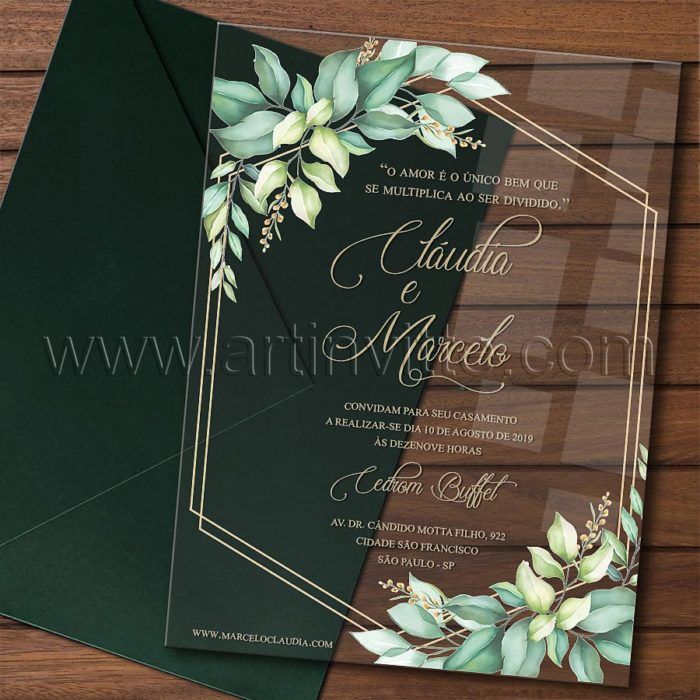 an elegant wedding card with greenery and gold foil on the front, in dark green