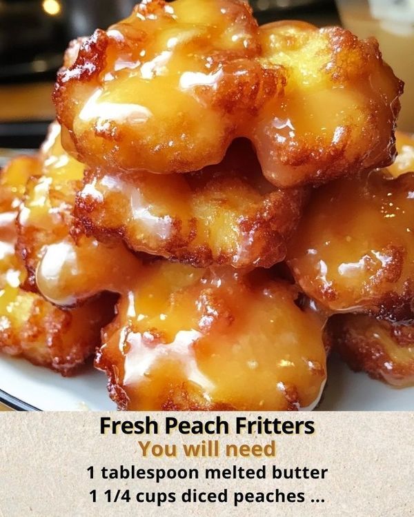 a pile of fresh peach fritters sitting on top of a white plate