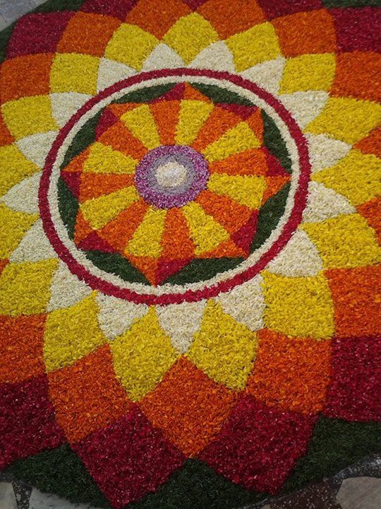 a colorful flower arrangement on the ground