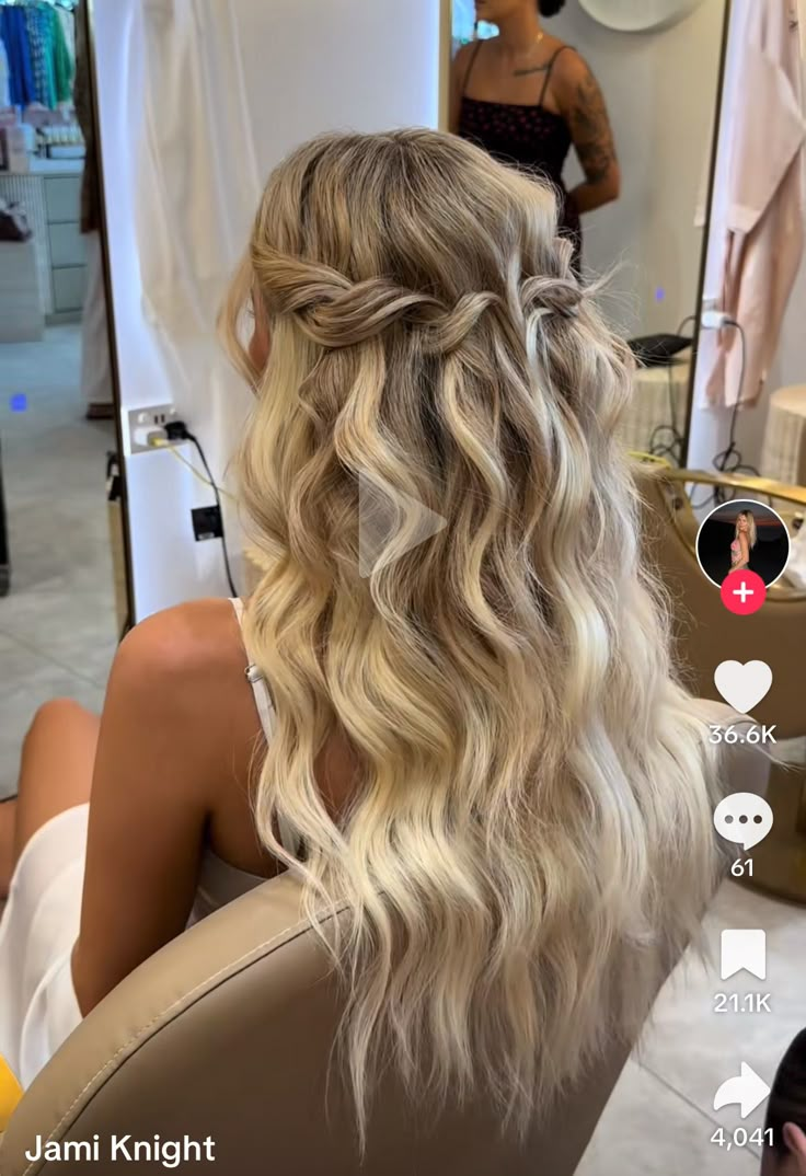 the back of a woman's head with wavy blonde hair