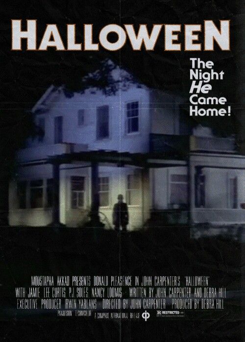 a movie poster for halloween the night he came home with two people standing in front of a house