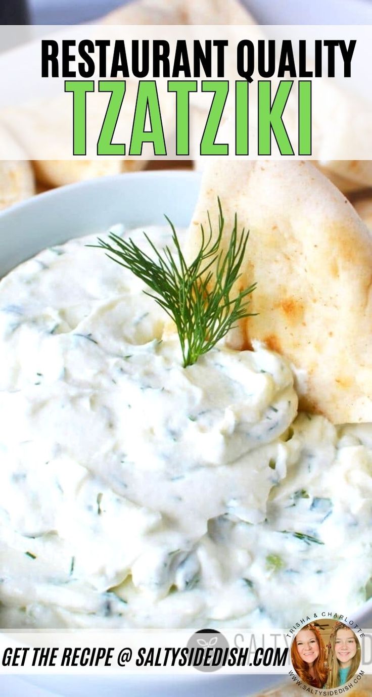 a white bowl filled with tzatzki sauce and some crackers on the side