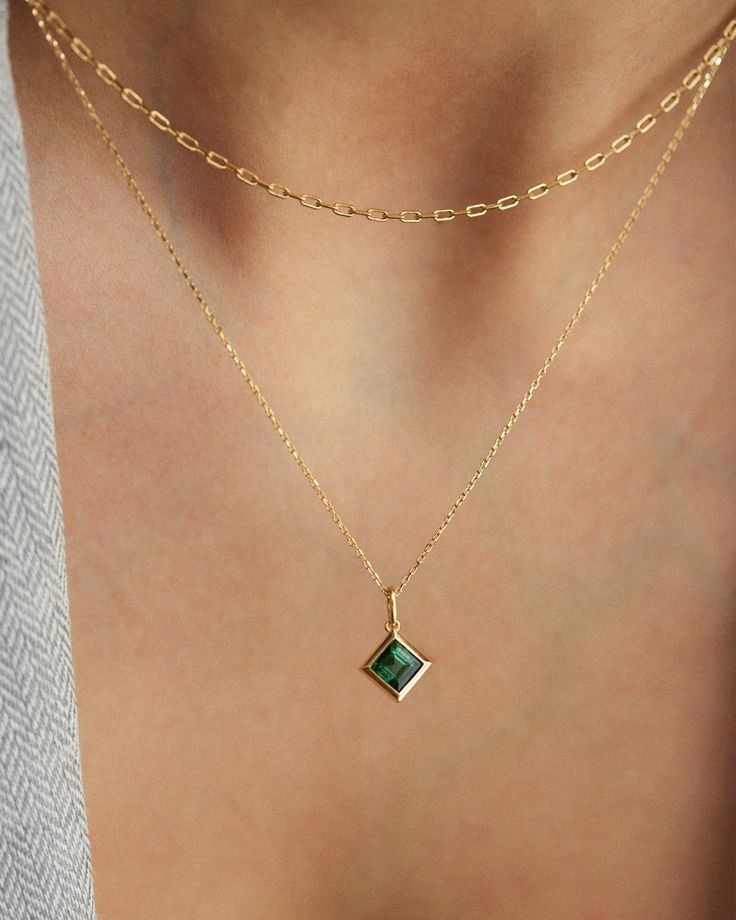 Discover the timeless beauty of our 14K Solid Gold Green Tourmaline Necklace, a piece that adds elegance and grace to your style. This captivating gemstone pendant, set in 14K solid gold, not only captures attention with its vibrant green hue, but also allows you to create your own jewelry set by effortlessly detaching the pendant and setting it on a chain of your choice. The tourmaline's vibrant green tone brings color and passion to any ensemble, making it an excellent accent for everyday wear and occasions. Details  * 5mm square natural green tourmaline * Removable pendant  * Chain length: 40cm + 3cm (16" + 1.18") * Ready to ship in 14K yellow gold All of my pieces are Made-To-Order, which means that each piece is uniquely made for you. If you like to order a custom length, don't hesita Elegant Tourmaline Pendant Jewelry, Elegant Emerald Pendant Birthstone Necklace, Timeless Gemstone Necklace For May Birthstone, Classic Gold Tourmaline Jewelry, Elegant Gold Tourmaline Jewelry, Elegant Tourmaline Yellow Gold Necklace, Elegant Yellow Gold Tourmaline Necklace, Timeless Emerald Gemstone Necklaces, Elegant Emerald Pendant Necklace With Bezel Setting