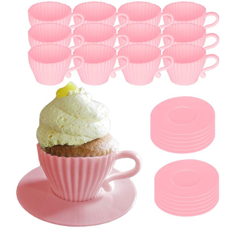 a cupcake with frosting on top next to pink cups