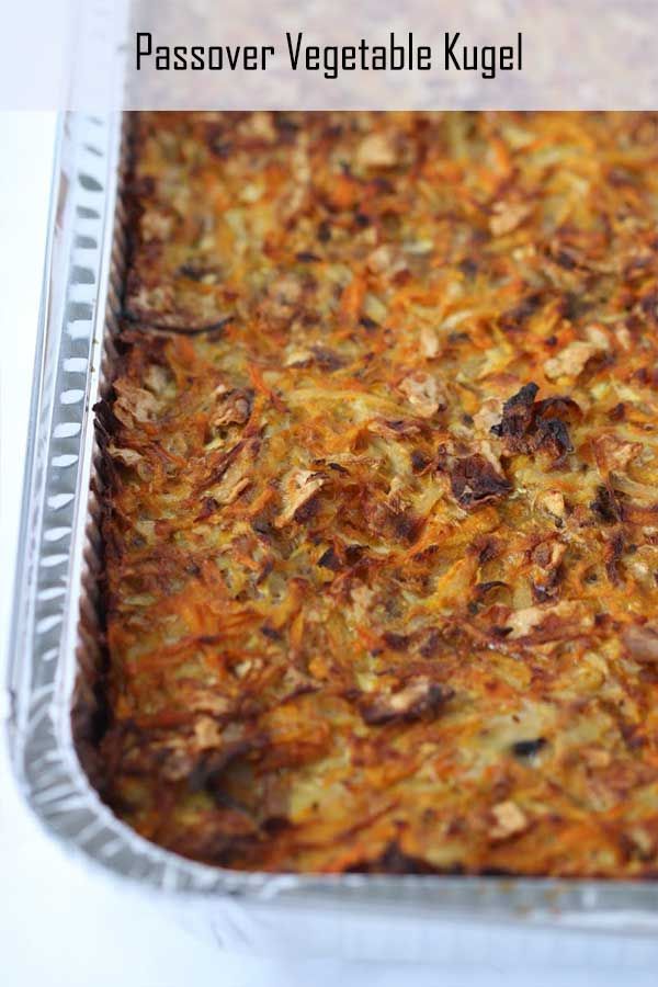 a casserole dish with carrots and meat in it