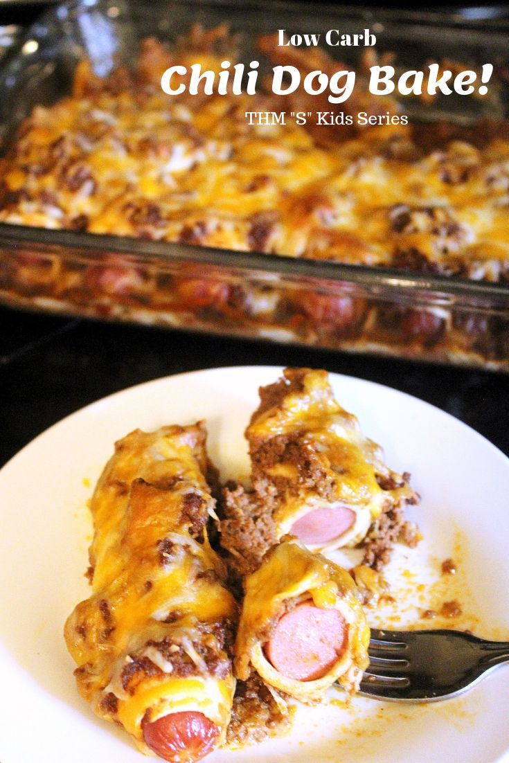 a white plate topped with food next to a casserole covered in meat and cheese