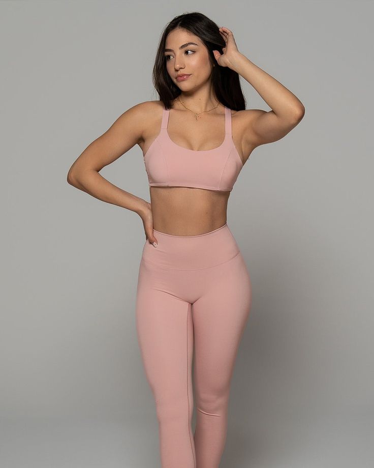 Stay supported while you sweat with this Stardust Pink Sports Bra. Featuring a solid color design, scoop neckline and strappy back - it's so stylish. Made from high-quality nylon-spandex material, it is soft and comfy. Plus, integrated quick-dry technology keeps you cool and dry. Wear with matching bottoms and fresh kicks for a simple but chic look. We are obsessed! Nylon T-back Activewear For Yoga, Nylon Strappy Back Activewear For Workout, Nylon Activewear With Strappy Back For Workout, Nylon Activewear With Built-in Bra And Strappy Back, Cross Back Activewear With 4-way Stretch, Nylon Compression Activewear With Cross Back, Moisture-wicking Cross Back Activewear, Solid Moisture-wicking Cross Back Activewear, Solid Color Cross Back Activewear With 4-way Stretch