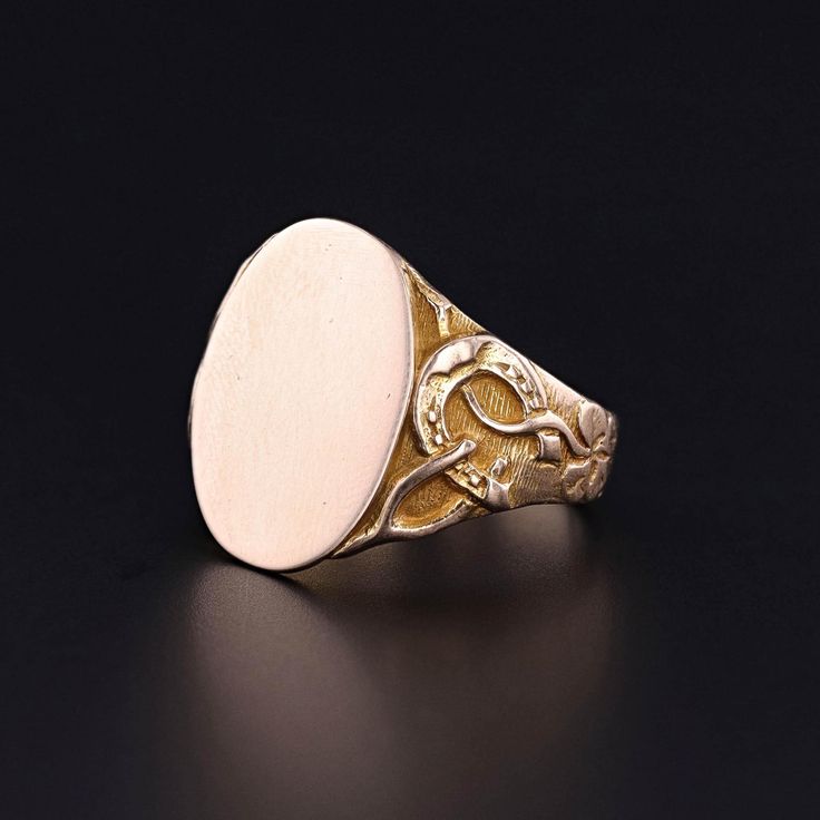 Antique Good Luck Ring: This antique signet ring features a horseshoe, wishbone, and four leaf clover on the shoulders of the 14k gold ring. The inside of the band bears the inscription 'Ednato Ira x1912'. The face measures 0.7 inches by 0.6 inches wide and is in great condition. It is a size 7, but can be resized free of charge. Upon purchase, your ring will arrive elegantly packaged, ready for gifting or as a special treat for yourself.  We carefully wrap each piece to ensure a delightful unboxing experience. We also offer free and flexible layaway plans, so take advantage of this option to make owning your dream piece even more achievable. + Trademark Antiques Shop Homepage https://www.etsy.com/shop/TrademarkAntiques + Our Store Policies https://www.etsy.com/shop/TrademarkAntiques/polic 14k Gold Timeless Signet Ring For Collectible, 14k Gold Timeless Signet Ring Collectible, Elegant Gold Horseshoe Rings, Timeless 14k Gold Signet Ring For Collectors, 14k Gold Elegant Engraved Ring, Elegant 14k Gold Engraved Ring With Hallmark, Antique Oval White Gold Signet Ring, Elegant Yellow Gold Horseshoe Rings, Heirloom 14k Gold Signet Ring With Maker's Mark