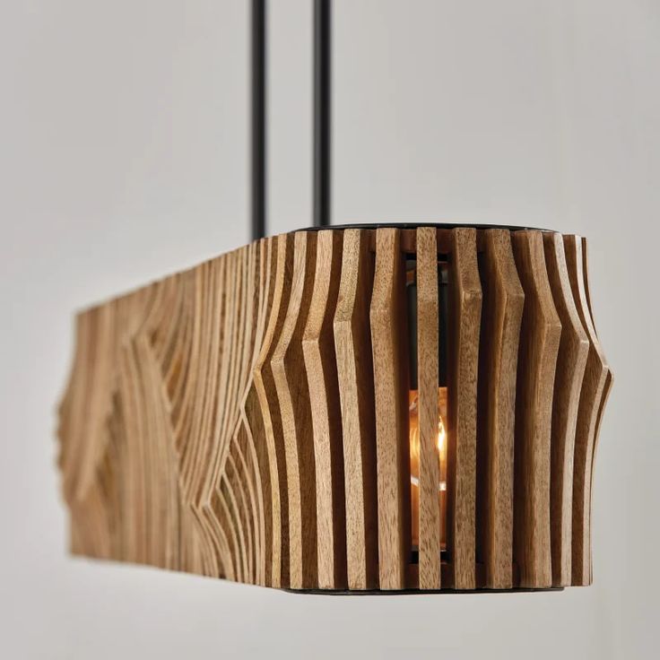 a wooden light hanging from a ceiling fixture with a candle in the center and two lights on each side