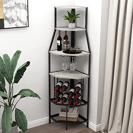 three tiered wine rack in the corner of a room with a potted plant