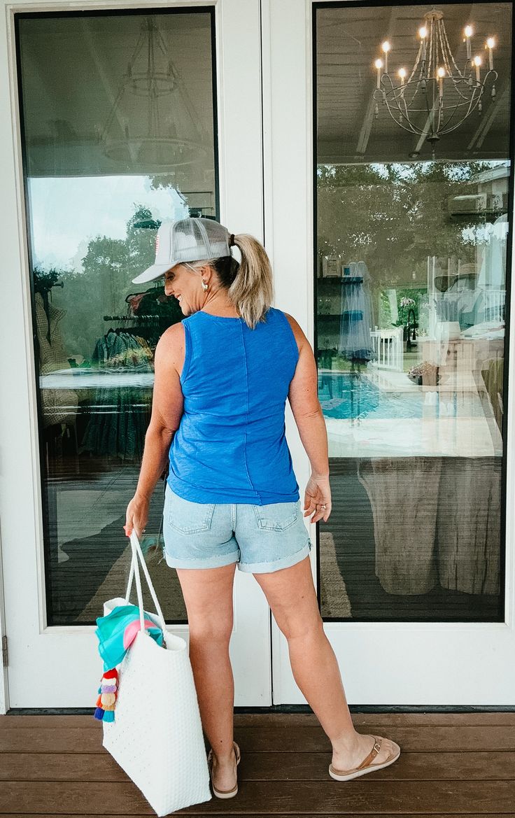 This ultra-comfy tank features a v-neck and front seam detail for added interest. In coveted summer shades, you'll have this seasonal basic in regular rotation this summer and beyond. True to size for a more fitted look or size up 1 for a more relaxed look. Janell is 5’5” and a size 6 wearing size medium (size up). Dana is 5’4” and a size 12 wearing size large (true size). *100% Cotton *Body Length: 25"/26" *Slubbed Jersey XS: 0-2 S: 4-6 M: 8-10 L: 10-12 XL: 14 *Items ending in $.98 indicate cle Sporty Summer Tops With Upf 50+, Summer Athleisure Tank Top For Everyday, Athleisure Summer Tank Top For Everyday, Athleisure Tank Top For Everyday Summer Use, Solid Summer Tops With Upf 50+, Blue Tops With Upf 50+ For Summer, Comfortable Tops For Summer Day Out, Comfortable Summer Tops For A Day Out, Spring V-neck Athleisure Tank Top