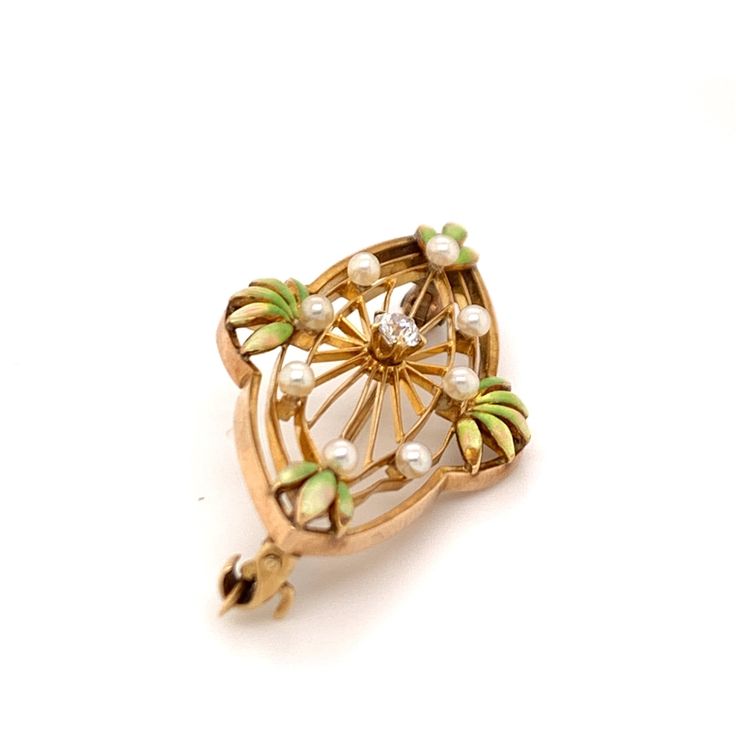 FREE shipping on all orders! FREE 5 Day Returns! Learn More. Part of our Vintage Collection, a spectacular American Art Nouveau Krementz brooch. The 14K yellow gold brooch features a filigree oval setting with green enameled leaves dotted with seed pearls. A prong set old European cut diamond adorns the center. Brooch or Pin Closure Type: C Clasp with Safety Clasp Hallmark: 14K and Krementz Trademark Designer: Krementz Era: Art Nouveau Total Weight: 2.80 dwt Center Diamond: (1) Old European Cut, Art Nouveau Enamel Brooch Jewelry, Antique Green Brooch For Anniversary, Antique Green Brooches For Anniversary, Heirloom Style Oval Filigree Brooch, Heirloom Filigree Oval Brooch, Heirloom Oval Filigree Brooch, Elegant Green Filigree Brooches, Elegant Green Oval Brooches, Green Art Nouveau Wedding Brooches