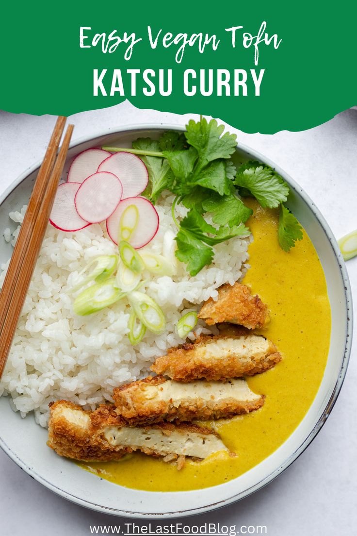 a plate filled with rice and chicken next to chopsticks