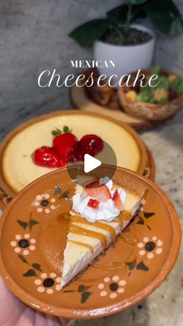 a person holding a piece of cheesecake with whipped cream and strawberries on top