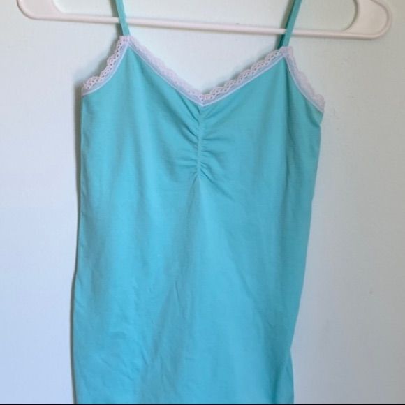 Spaghetti Strapped Light Blue Cami Size S In Excellent Condition/ Never Worn Blue Seamless Camisole For Spring, Blue Stretch Camisole With Spaghetti Straps, Blue Strapped Camisole For Summer, Summer Blue Camisole With Straps, Blue Stretch Camisole With Straps, Light Blue Camisole Tank Top For Spring, Blue Stretch Camisole With Adjustable Straps, Blue Strappy Camisole For Summer, Casual Light Blue Tank Top With Spaghetti Straps