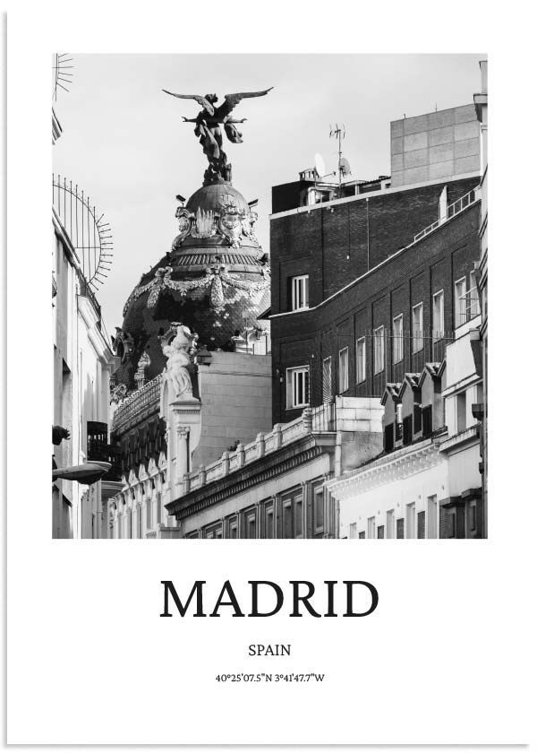 the cover of madrid spain, with an eagle statue in the center and buildings behind it