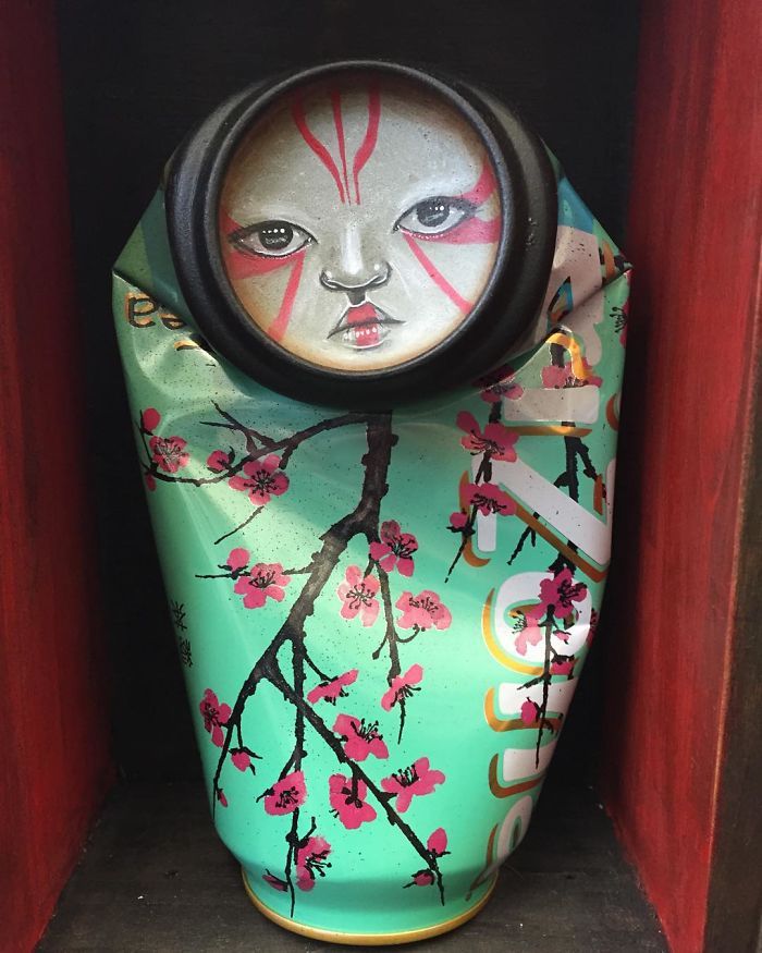 a colorful vase with a clock on it's face and flowers painted on the side