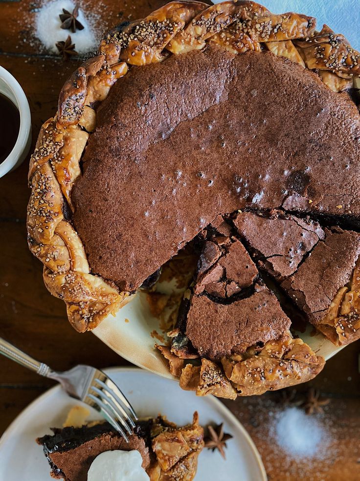 a chocolate pie on a plate with a slice cut out