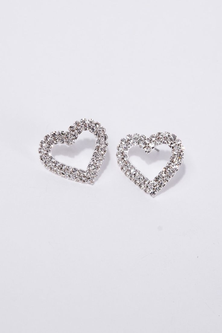 Add a touch of elegance to your Valentine's Day look with our Brianna Heart Pave Drop Earrings. Featuring stunning heart-shaped pave stones, these earrings will make a statement of love and sophistication. Made with high-quality materials, they are sure to be a treasured addition to any jewelry collection. SizeHEIGHT: 0.75"WIDTH: 0.9" QualityMade with Quality Materials for Endurance. ImportedE7074 Double Heart Rhinestone Jewelry For Party, Heart-shaped Earrings With Sparkling Stones For Wedding, Glamorous Drop Earrings For Valentine's Day, Valentine's Day Formal Crystal Earrings, Silver Heart Drop Earrings, Glamorous, Glamorous Heart Earrings With Rhinestones As Gift, Heart-shaped Sparkling Earrings For Wedding, Elegant Double Heart Earrings For Party, Elegant Rhinestone Heart Earrings As Gift