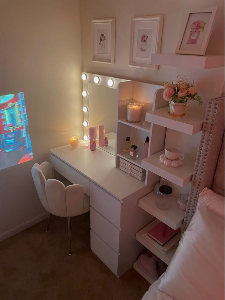 a bedroom with a vanity, mirror and lights