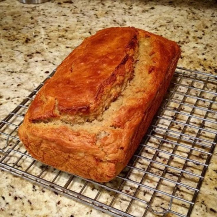 a loaf of bread sitting on top of a cooling rack