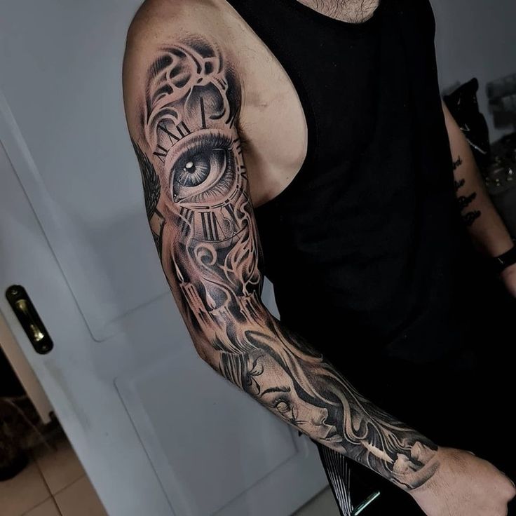 a man with a tattoo on his arm