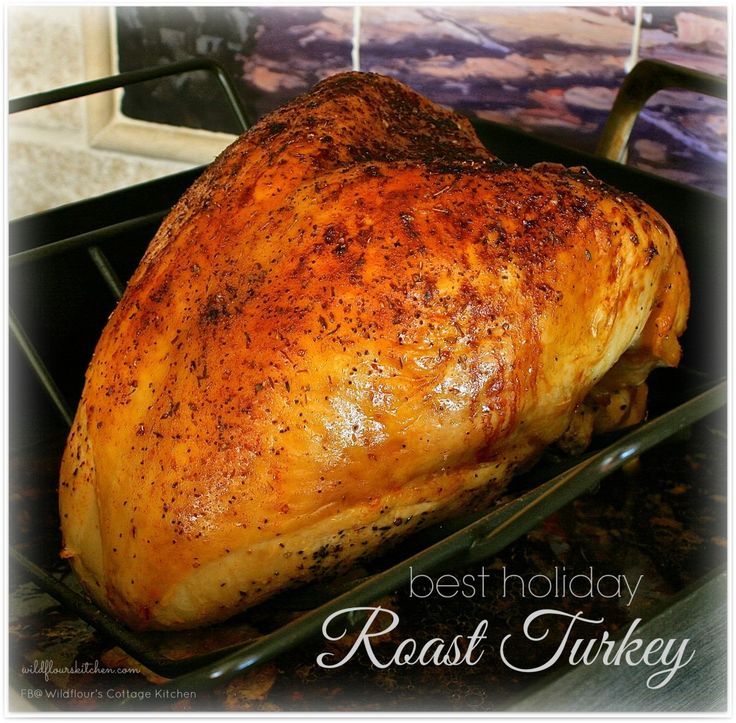 a roast turkey sitting on top of a pan in an oven with the words best holiday roast turkey