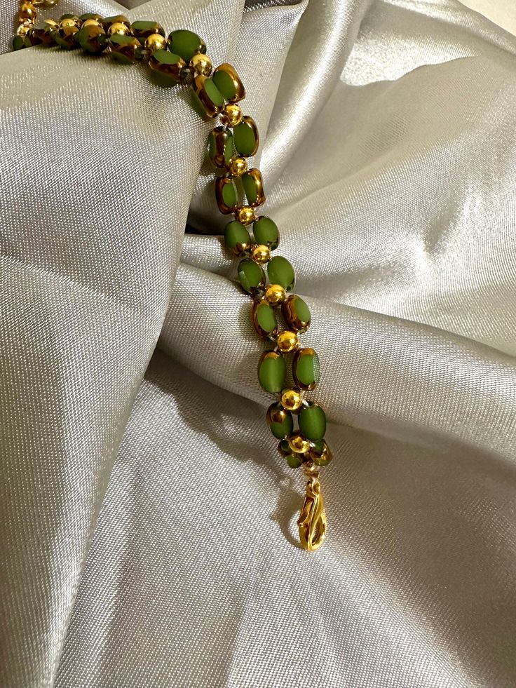 Our delicate bracelet is very suitable for daily wear.It can be also be given to girlfriends,daughters,mothers,stepmom,or as a birthday gifts to friends.  🦋Main materials :  Green beads,3mm 14k gold plated round beads 🦋My bracelets is about 6-7 inches without extension chain so they can be suitable for most people's wrist,and if you had big wrist,still no problem with 2.5 inches extension  🦋About packaging: Our bracelet is packaged in a simple white box. 🦋About shipping: we ships the order next day, If you have any question,please feel free to contact me. 🦋Thank you for visiting my shop, I hope you enjoy your jewelry as much as we enjoy making it for you. Please visit my shop page for many more exciting items. Check back frequently as new designs are added regularly.    https://assali Adjustable Green Bracelets With Gold Beads, Adjustable Green Beaded Bracelets With Gold Beads, Jade Bracelets With Spacer Beads As Gift, Green Beaded Bracelets With Spacer Beads As Gift, Green Beaded Bracelet With Tiny Beads As Gift, Green Beaded Bracelet As Gift, Green Beaded Bracelets For Festive Occasions, Green Hand Wrapped Beaded Bracelets As Gift, Gold Single Strand Spiritual Bracelet