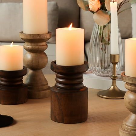 some candles are sitting on a table