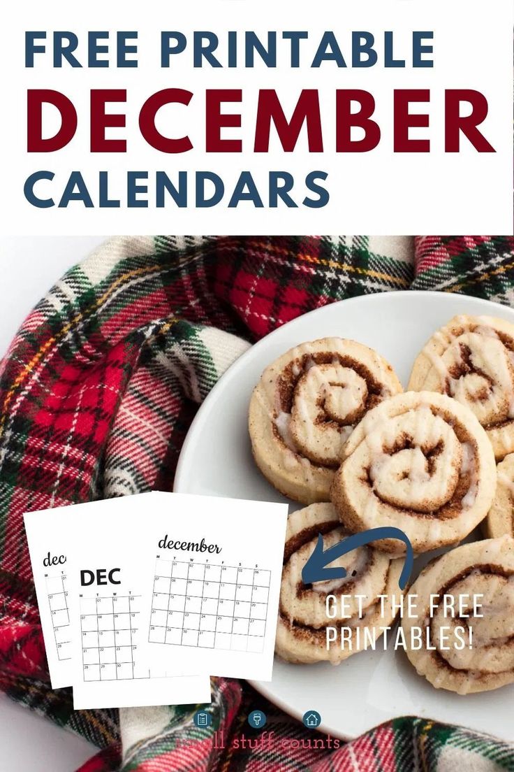 a white plate topped with cinnamon rolls next to a calendar