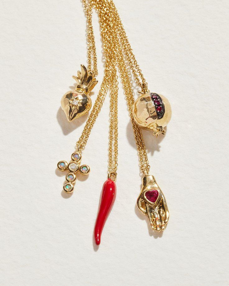 Revisiting one of the motifs from our first collection, the heart it hand is symbolic of charity given from the heart. This delicate, nostalgic piece features a carefully hand-carved open hand, accented by a deep red heart-shaped¬†ruby. Crafted in recycled 14k yellow gold, the charm hangs from a delicate chain and beautifully sits¬†on the collarbone.¬†Ideal¬†to be worn individually¬†or layered with other necklaces to create a personal combination. SIZE & MATERIALS Composition:¬†14k yellow gold, Heart In Hand, Hand Pendant, The Sacred Heart, Glass Bangles, Delicate Chain, Pink Opal, Sacred Heart, Heart Jewelry, White Topaz