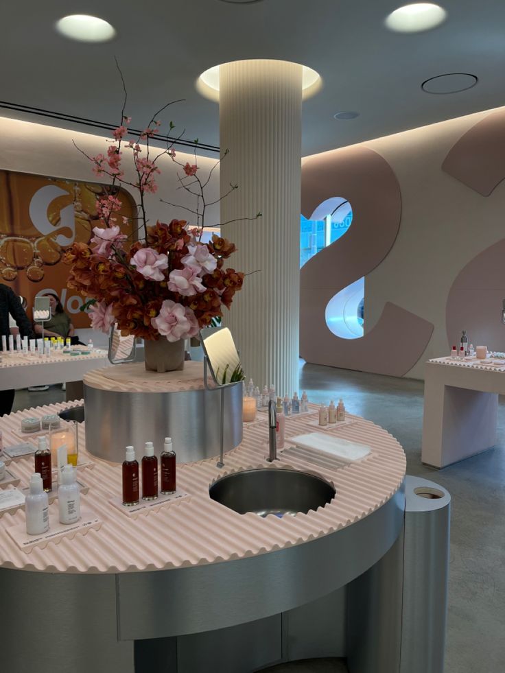 a counter with bottles and candles on it in a room that looks like a spa