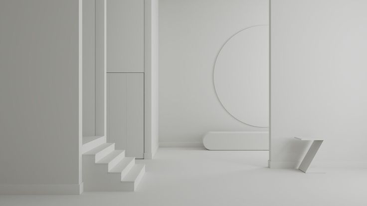 an empty room with white walls and stairs