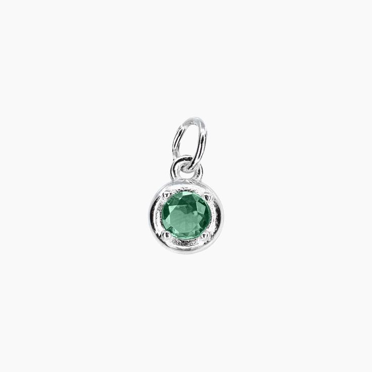 This Birthstone Charm is inspired by the concept of birthstones, precious stones that correspond to different birth months. This sterling silver design features a single, brilliantly cut cubic zirconia in a sparkling diamond-faceted style. A great gift for a friend or loved one, this pendant is a chic choice for every day, you can order other birthstones for even more customization. Also available in Gold *Birthstone Charm only - chain not included. PRODUCT DETAILS Pendant Diameter: 1/4" Stone: Round Cut Cubic Zirconia Gemstones For Gift, White Gold Sterling Silver Gemstones With Round Stone, Sterling Silver Birthstone Pendant, Modern Birthstone Gemstones For Anniversary, Classic Birthstone In White Gold Setting, Elegant Silver Gemstones For May Birthstone, Modern Anniversary Birthstone Gemstones, Modern Emerald Birthstone Jewelry, Modern White Gold Gemstones For Gift