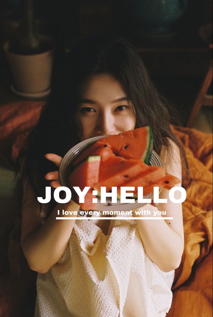 a woman holding a plate with slices of watermelon on it and the words joy helio above her